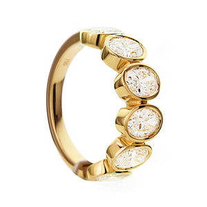 18KT yellow gold band with 2.45ctw oval bezel set diamonds, ...