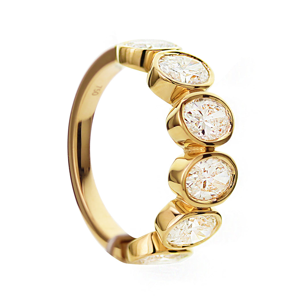 18KT yellow gold band with 2.45ctw oval bezel set diamonds, ...