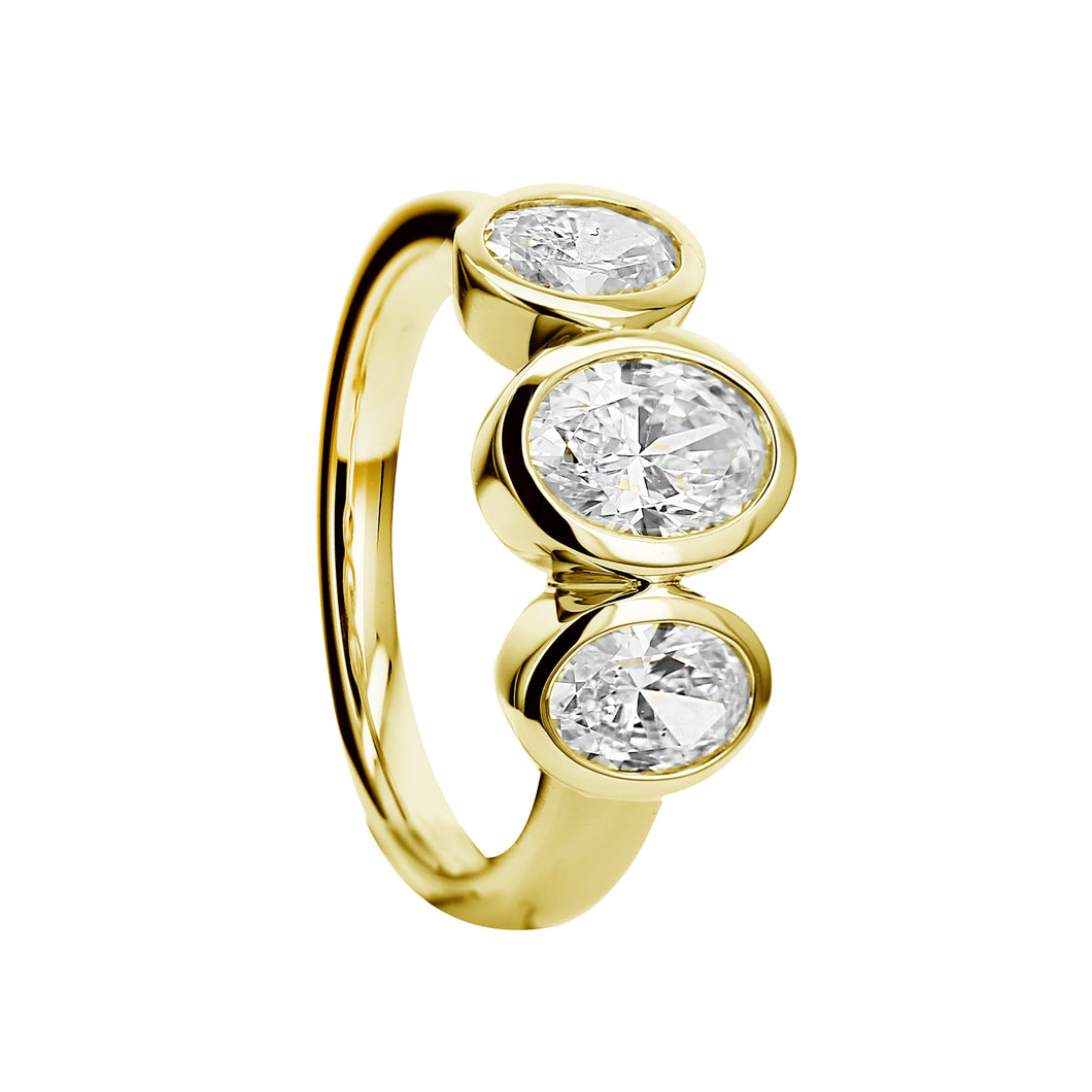 18KT yellow gold bezel set three-stone ring with 0.75ct oval...