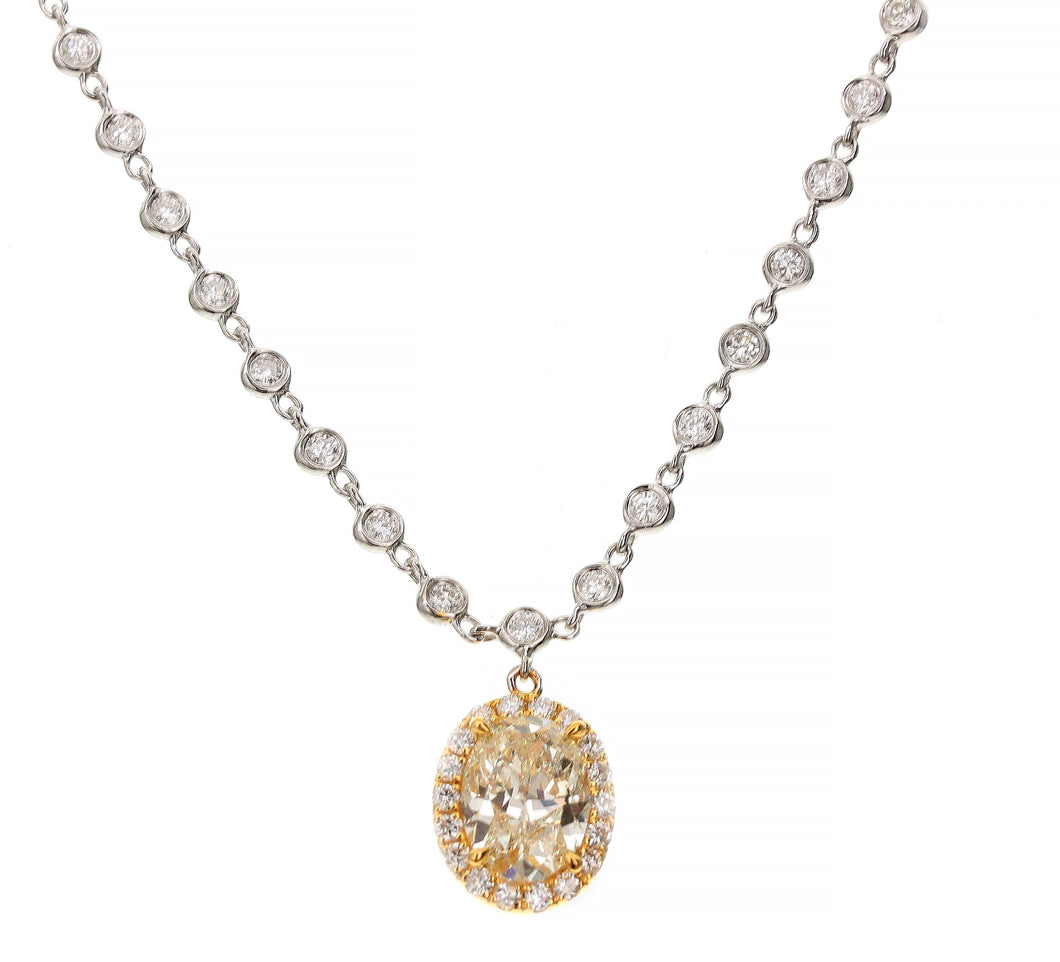 18KT white and yellow gold necklace with 2.20ct oval yellow ...