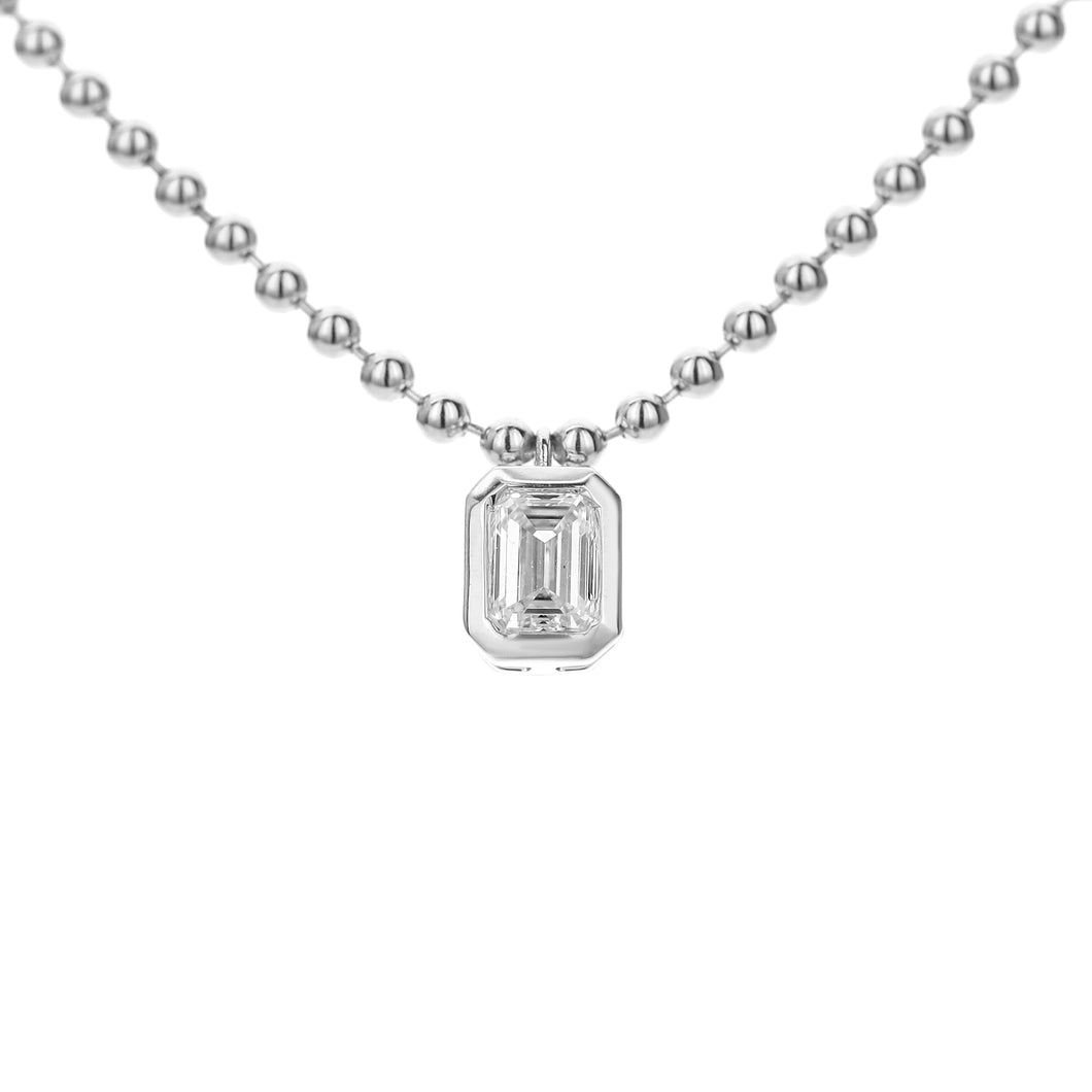 18KT white gold necklace with 0.52ct bezel set emerald cut, ...
