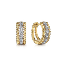 Load image into Gallery viewer, 14KT yellow and white gold Bujukan huggie earrings with 0.25...
