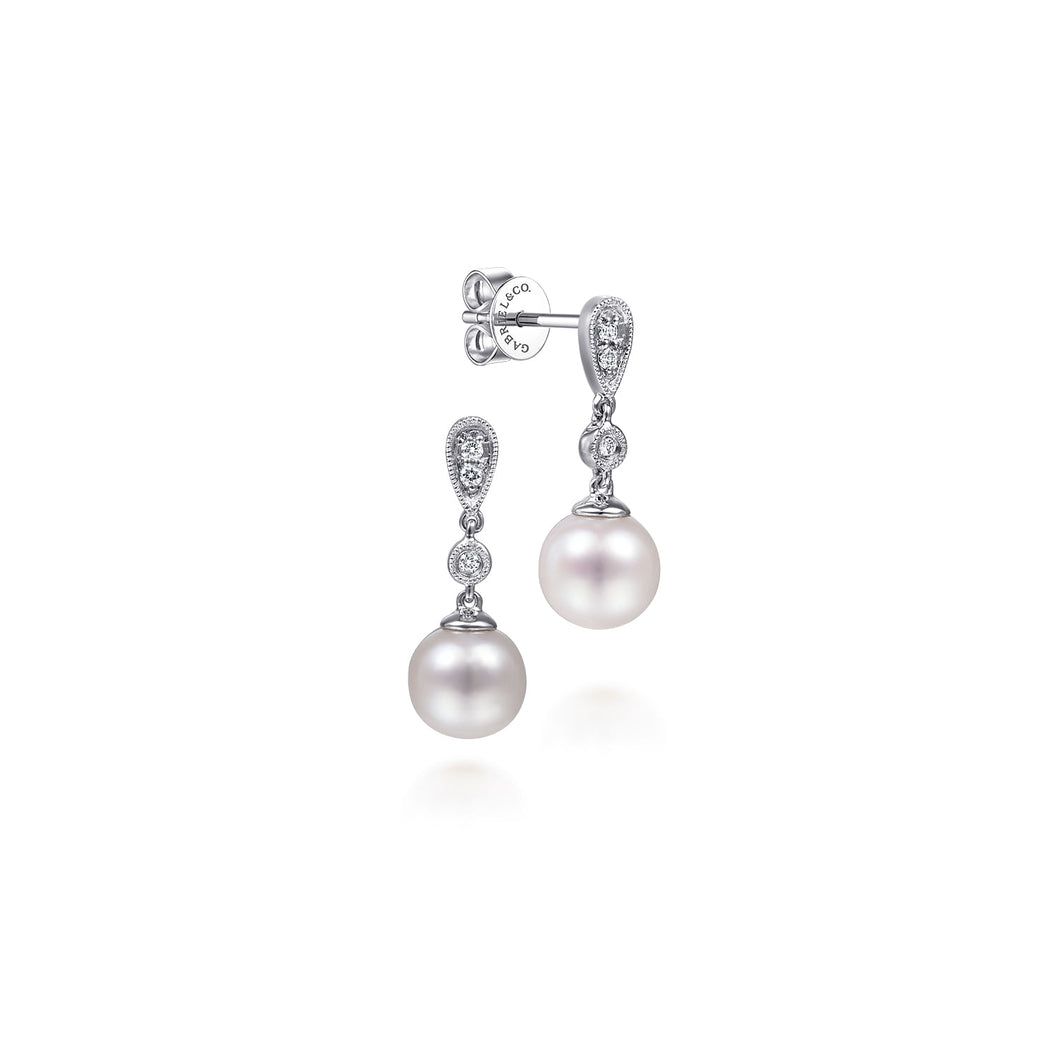 14KT white gold pearl drop earrings with 0.07ctw round diamo...