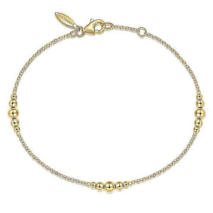 14KT yellow gold chain bracelet with graduated bead stations...