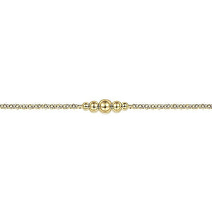 14KT yellow gold chain bracelet with graduated bead stations...