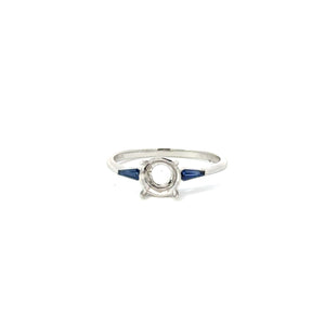 14KT white gold three-stone ring with 0.22ctw tapered baguet...