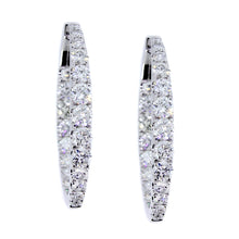 Load image into Gallery viewer, 18KT white gold oval inside-out hoop earrings with 3.50ctw g...
