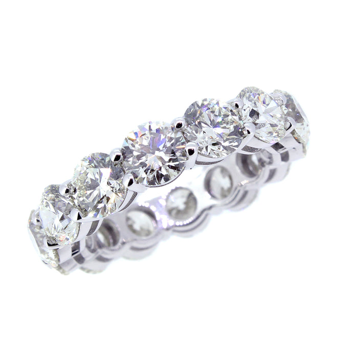 18KT white gold eternity band with 7.08ctw round diamonds, J...