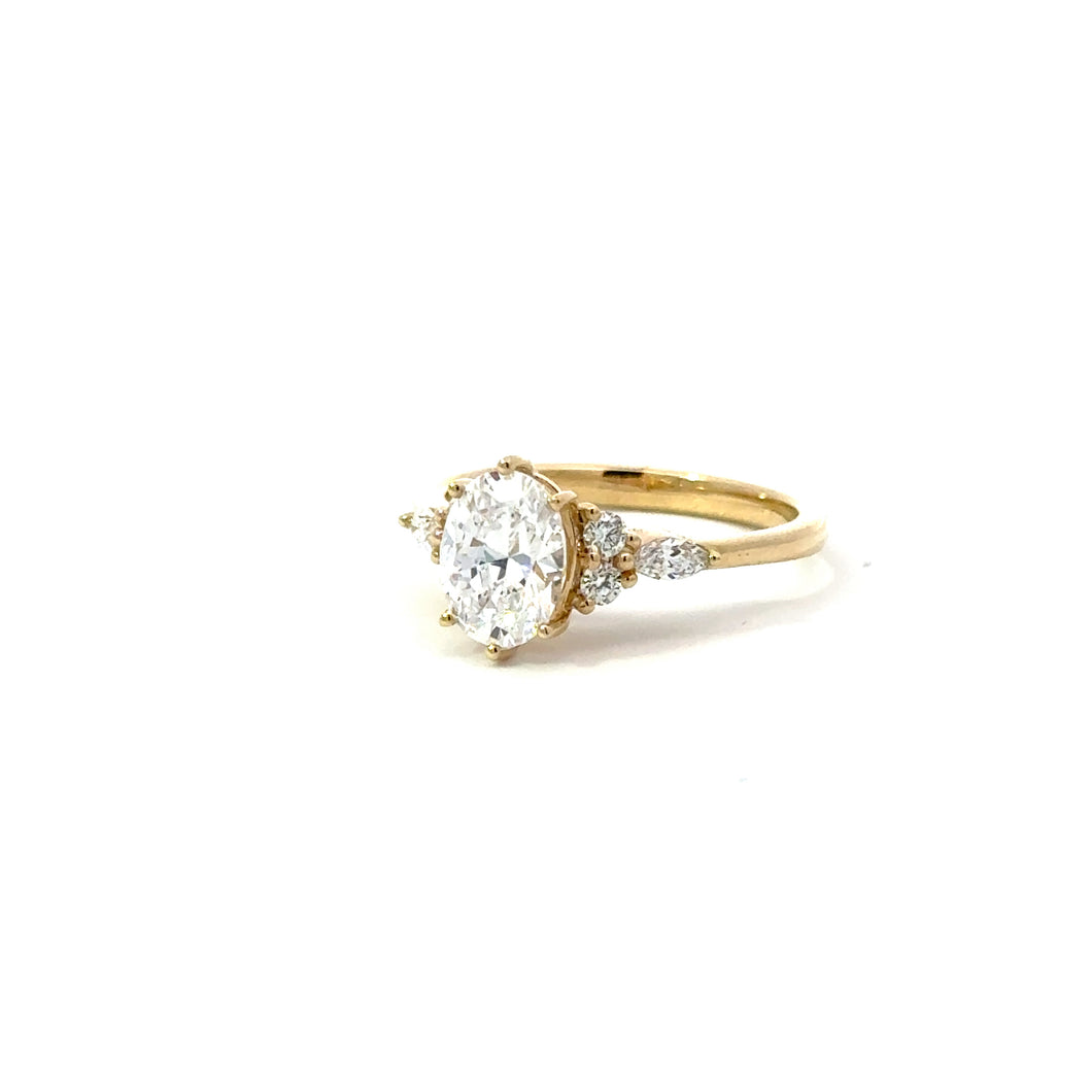 14KT yellow gold engagement ring with 0.14ctw round and marq...