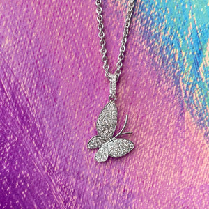 14KT white gold butterfly pendant with 0.42ctw round diamond...