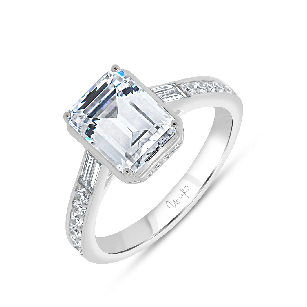 Platinum engagement ring with 0.36ctw round and 0.20ctw bagu...