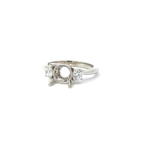 14KT white gold three-stone ring with 0.60ctw round diamonds...