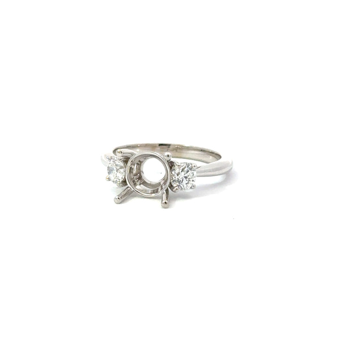 14KT white gold three-stone ring with 0.60ctw round diamonds...