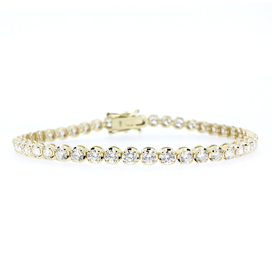 14KT yellow gold tennis bracelet with 5.00ctw round diamonds...