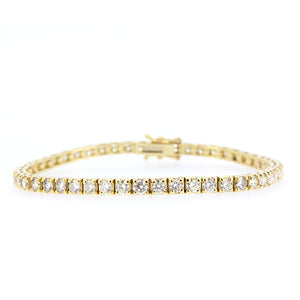 18KT yellow gold tennis bracelet with 5.14ctw round diamonds...